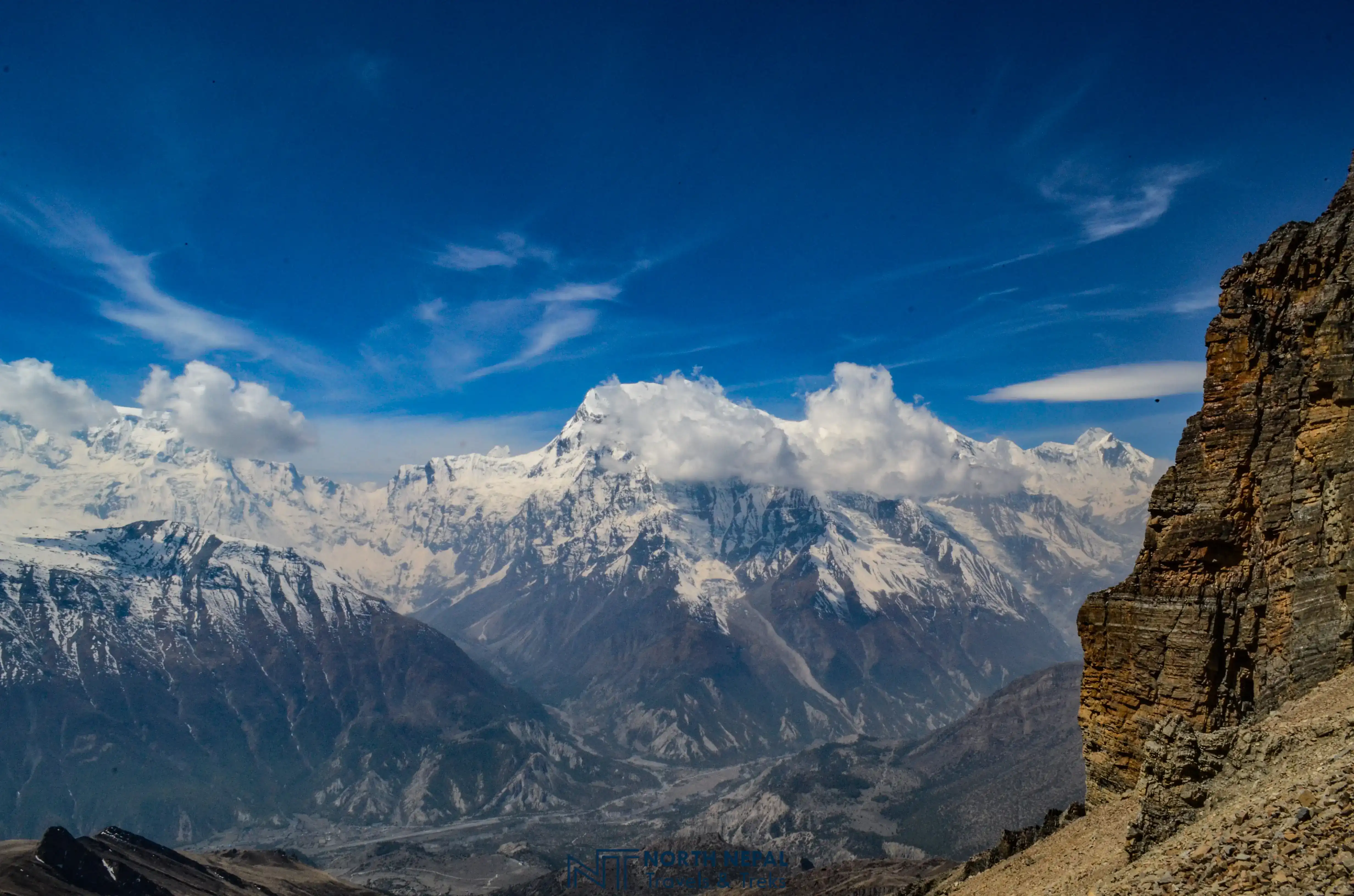 Ancient stone village of Nar with dramatic canyon walls and Himalayas