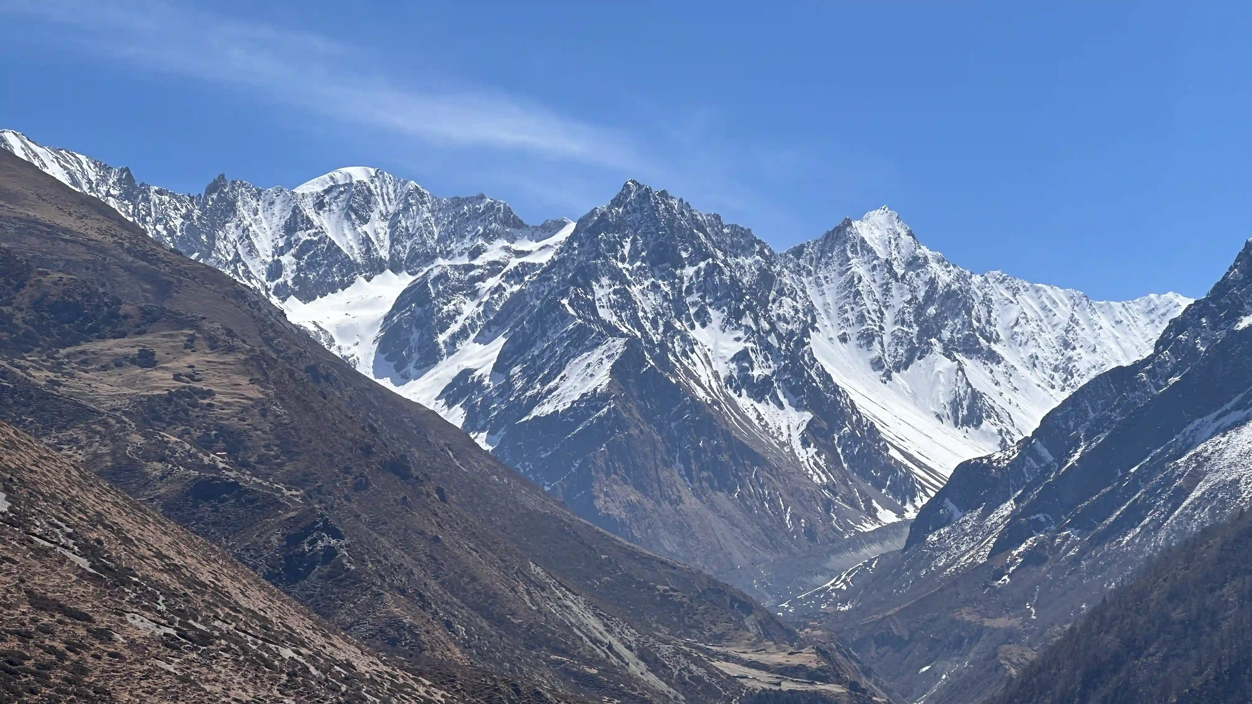 Ancient Tibetan Buddhist monastery in Tsum Valley with Ganesh Himal backdrop